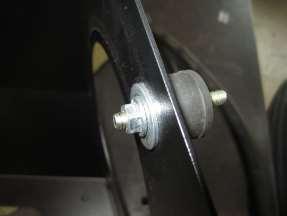 flat washer (X) and M6 nut. (U). Note that the slotted hole in the bracket is facing down.