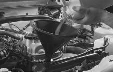 2. Then keep turning the pressure cap, but now push down as you turn it. Remove the pressure cap. 3. Fill the radiator with the proper coolant mixture, up to the base of the filler neck.
