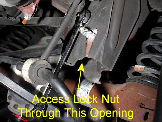 14. It s time to lock the panhard bar in place. You ll notice that the jam nut on the passenger side is inaccessible for a wrench.