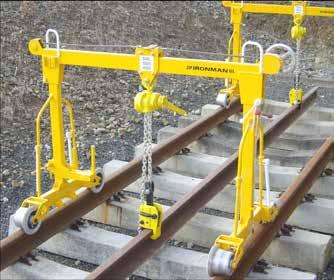 The clamp has a narrow profile to enable attachment to an individual rail that is stacked side be side with other rails.