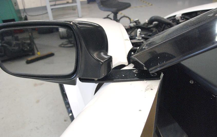 Mount the side view mirror bracket to the door using the