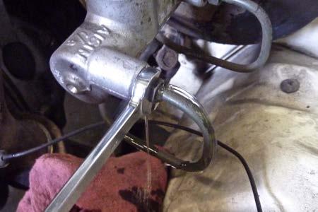 Step 17 When the brake pedal reaches the floor (or the fluid stops coming out), tighten the the brake line fitting.