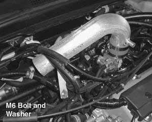 g. Install the supplied 5/8 breather hose from the AEM primary inlet pipe to the valve cover.