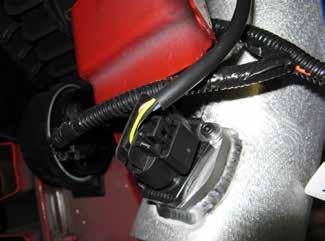 n. Carefully route the washer fluid hose and pump harness away from