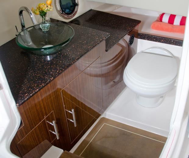 Cherry cabinetry, vessel sink and soft step floor are