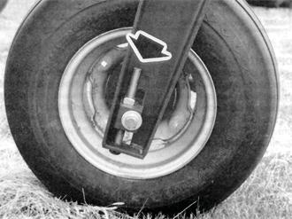 Changing the length of chain or sliding the spring anchor adjusted the spring tension. The length of the marker was adjusted by loosening two bolts and sliding the marker tube within the swing tube.