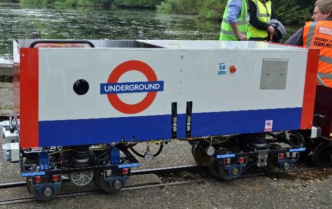 London Underground New entry 5.5 kva petrol generator powers two 1.1 kw 3 phase AC induction motors via motor invertors. Motor drives axles by chain and sprocket.