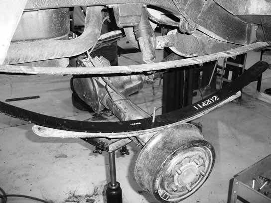Figure 4 Post-Installation Warnings Figure 5 11. Raise the axle to the leaf spring, aligning the center pin with the center pin hole in the axle. Fasten with the provided u-bolts, nuts and washers.