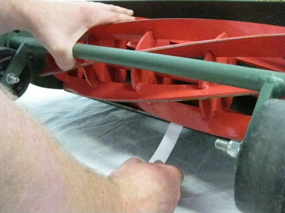 Heavy Duty & Commercial Reel Adjustment (Continued) Step 3 Take a piece of thin paper, such as from a phone book or newspaper. Place a small part of the paper between the cutter bar and blade.