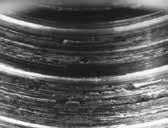 This adhesion wear occurs between threads of equal hardness, leading to galling, loss of thread form, and reduced load capacity.