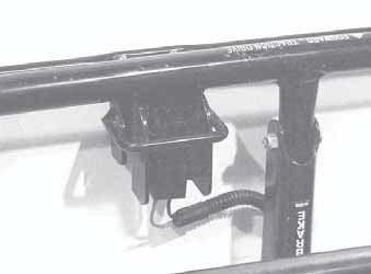 The operator must maintain a grip on the T-bar to keep the blade clutch running. The bail switch is located in the center of the T-bar on the upper handle.