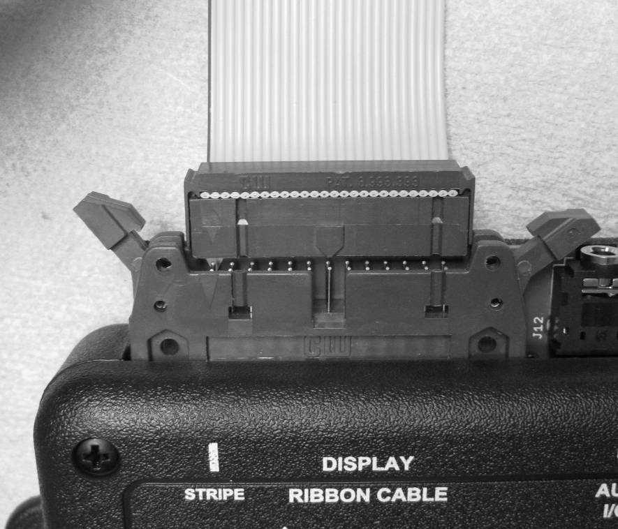 DISPLAY RIBBON CABLE This is where the grey cable from the display system plugs into the control box.