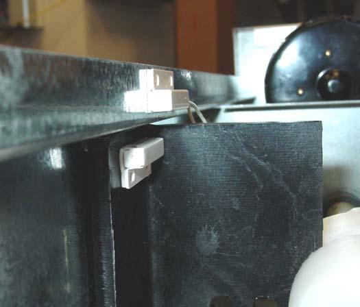 I. Mounting Auxiliary Status Switches to PowerTrak Jr. Cable End Magnet Status Switch (Cable End) Magnet Mounted on FIGURE 4 centered on the cabinet flange.