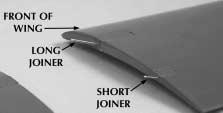 Align the joiners with the holes in the outer wing section and slide the two