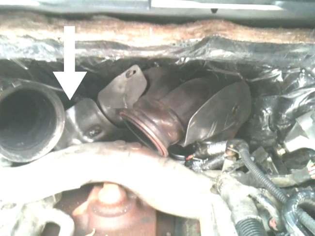 Step 12: From the topside of the engine loosen and