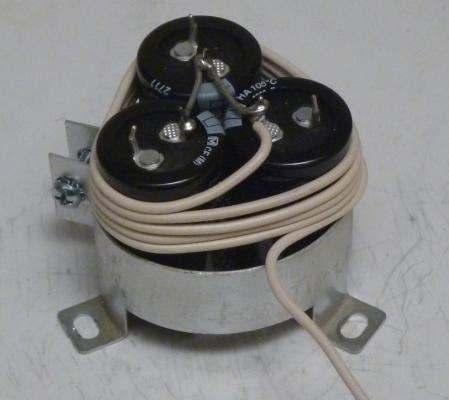 7. Wrap 5 turns of wire around the top of the capacitors, as shown in Figure 6.