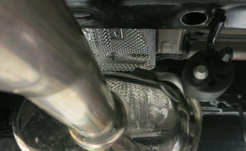 (f) Remove the OE muffler assembly from the vehicle.