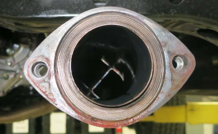 - (d) Install the exhaust gasket in between the muffler flange and the