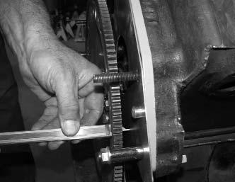 With the flywheel torqued in place and the block plate temporarily secured with 3 nuts use your machinists rule or caliper to take a measurement from the aft face of the block plate to the aft face