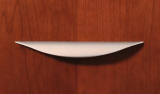Hand selected veneers accented with solid wood fluted edges finished in a rich satin gloss