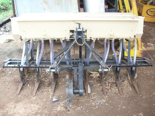 Seed drills, fitted with fertilizer dropping attachment, distribute the fertilizer uniformly on the ground. It is called seed cum fertilizer drill (Plate : 16.1 and 16.