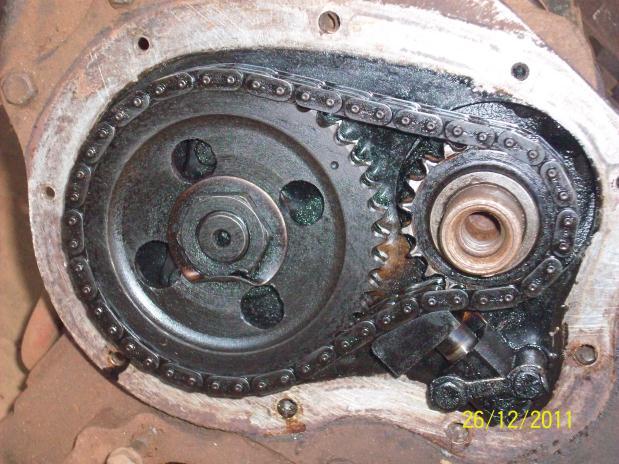 xv) Timing gear : Timing gear is a combination of gears, one gear of which is mounted at one end of the camshaft and the other gear at the end of the crankshaft.