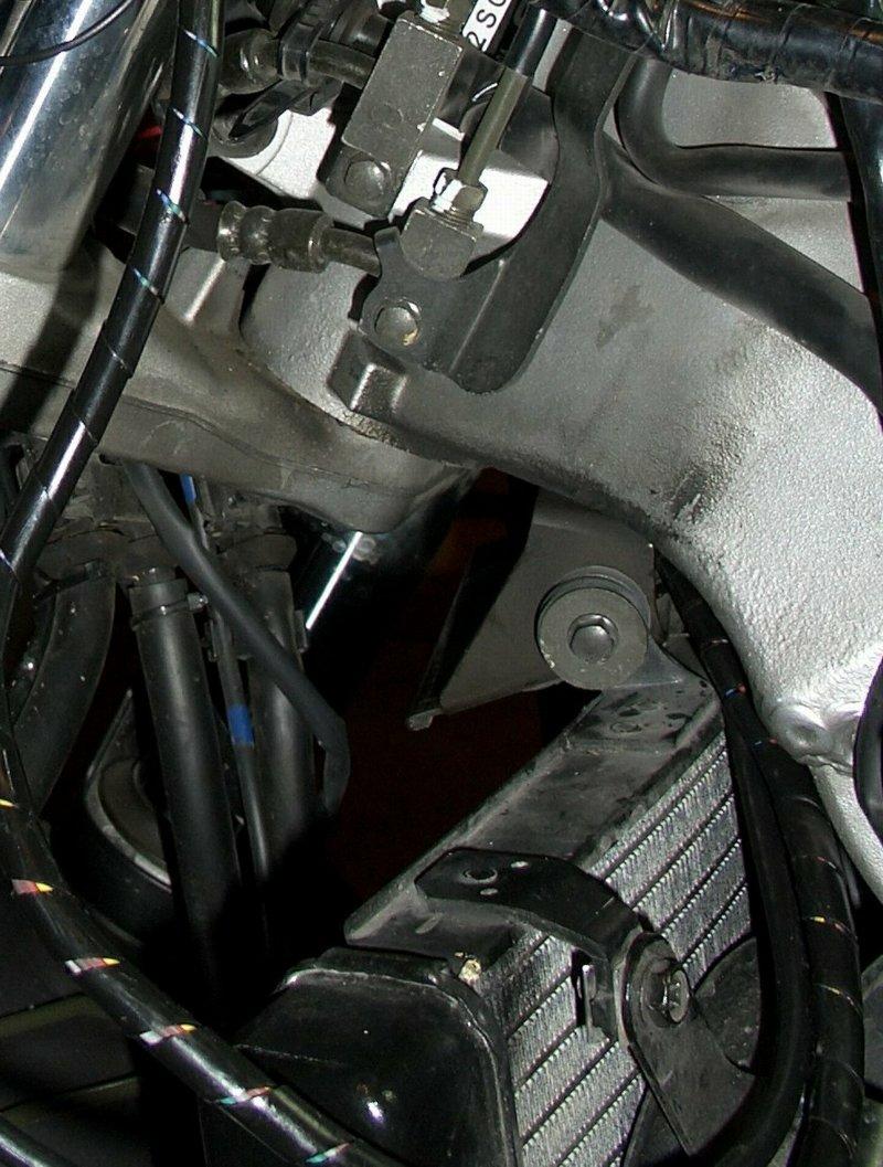 Cruise Throttle Cable Routing Cruise throttle cable through air inlet opening to reach the other side of frame.