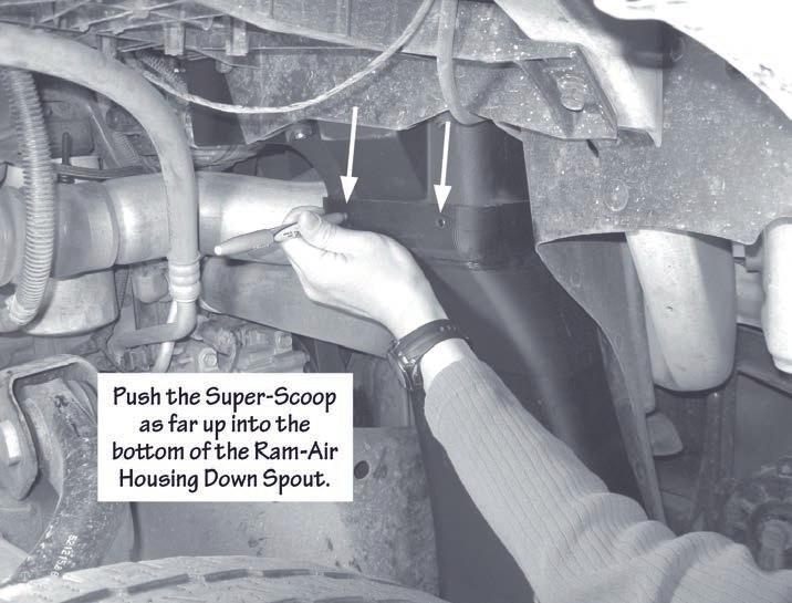 6. Lift up, align and fit the Banks Super-Scoop into position as far into the bottom of the Ram-Air housing down spout as possible.