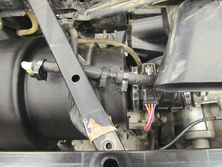 Connect the factory intake tube to the Airaid Air Box and tighten the clamp.