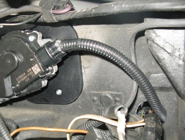 Connect the wiper harness to the wiper motor and re-install the original grommet. (Figure 23). Figure 23 Install Wiper Motor Connector 19.