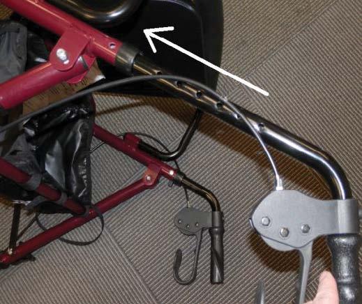 The brake cables should be on the outside of the handlebars and frame.