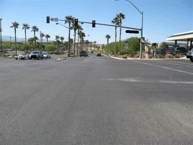 roadway and an east/west roadway (Figure 2). The intersection was controlled by three-phase traffic signals.