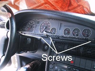 location of the three black wide-head Phillips screws: Photo Courtesy of rmccomiskie (1748) After placing a towel on top of the steering