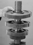 With Clutching teeth up, install the next Gear on Shaft against the previously positioned gear.