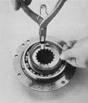 groove in retainer ring. Press the bearing fully into position.