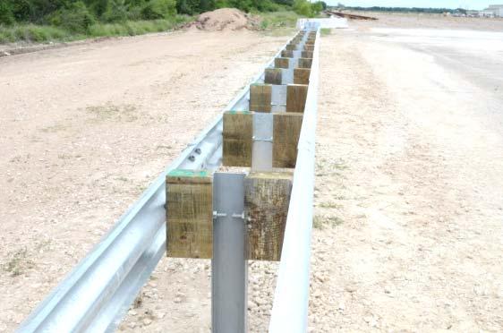 Abu-Odeh, et al. FIGURE Cross-section of the TxDOT -inch W-beam median barrier. FIGURE 0 TxDOT -inch W-beam median barrier installation.