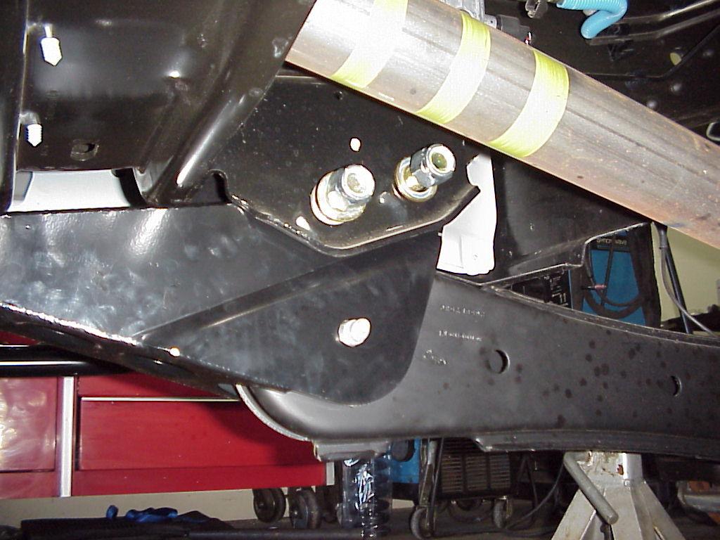 Remove the pivot bolts on rear of the radius arm.