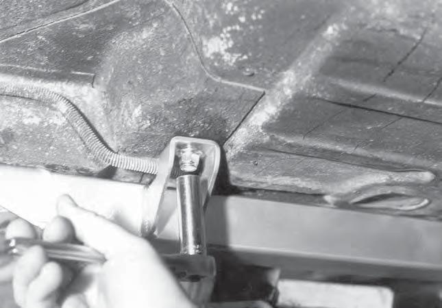 Slide a 3/8 inch flat washer over the bolt and secure with a 3/8-24 locknut.
