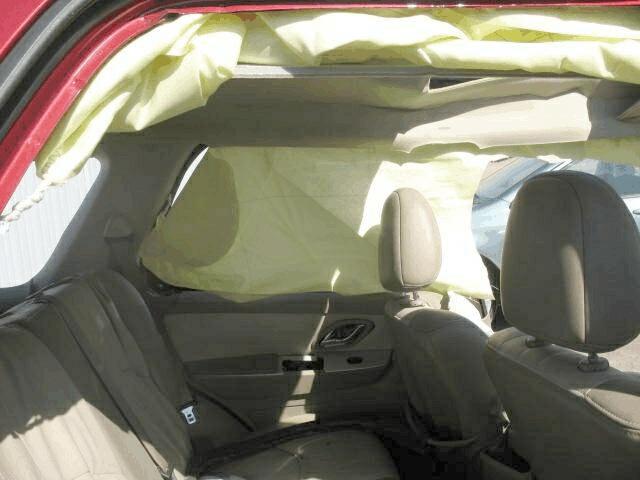 Automatic Restraint System (continued) The driver s seat-mounted side impact air bag deployed via a pre-stressed seam in the upholstery on the outboard edge of the driver s seat back