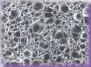 (100x microphotograph) SUPERsoft brand Sponge Rubber has an integrated, smooth outer skin