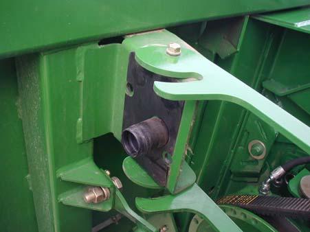 a) At first use, attach lever to header at left side of delivery opening, using 3/8 x 1