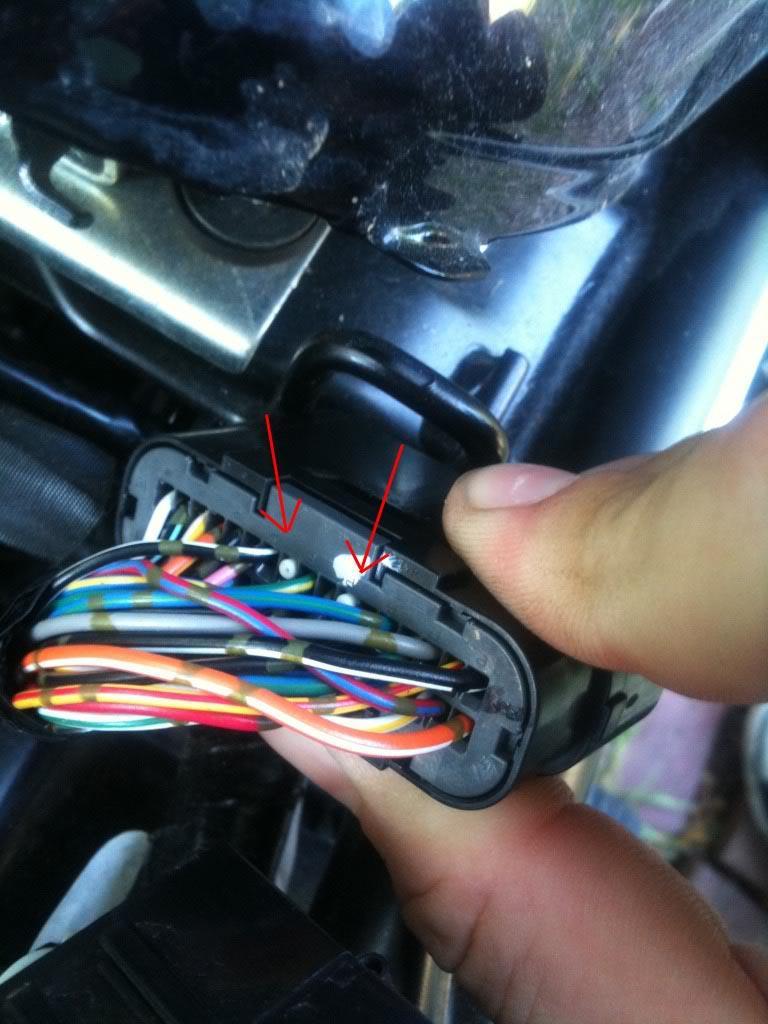 5) Use paper clip to push the plastic plugs out of ECU pins 25 and 28.
