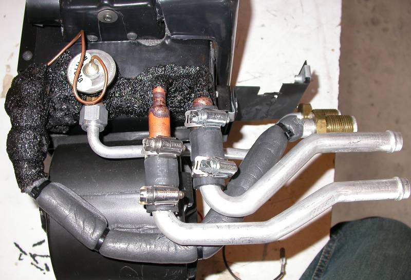 Locate evaporator and (4) hookup tubes from the unit box. Locate (4) hose clamps and (2) pieces of heater hose. Attach heater tubes to the heater outlets as shown.