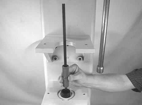 While holding bearing removal tool (BV) in position, insert extension tool (BZ)(25-08, part of tool kit 4500) into opposite end of pulley (BW).