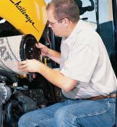 The engine oil is easily checked and topped off from ground level on the left side of the tractor.