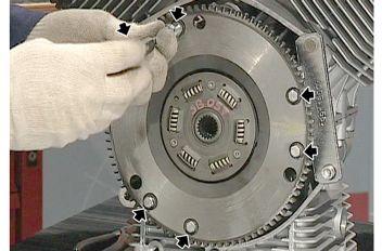 flywheel and tighten the screws to