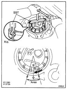 EG198 SFI SYSTEM (2JZGE) (b) Pull out the lower side of the fuel pump from the pump bracket. (c) Remove the rubber cushion from the fuel pump.