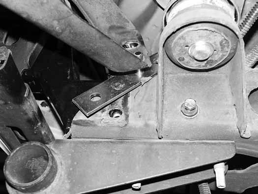 The bracket should be positioned so that the bottom hole lines up with the lower hole in the frame and the top stud is point toward the outside of the vehicle. 95.