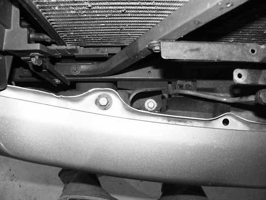 Figure 8 13. Since the grill was removed, the four inside bumper bolts (two on each side) can be accessed from above the bumper Figure 9.