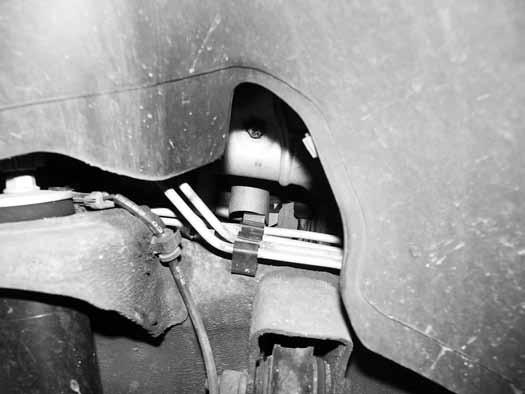 Figure 11»Parking» Brake Cable 16. Separate the parking brake cable at the coupler just below the driver s side door Figure 12.